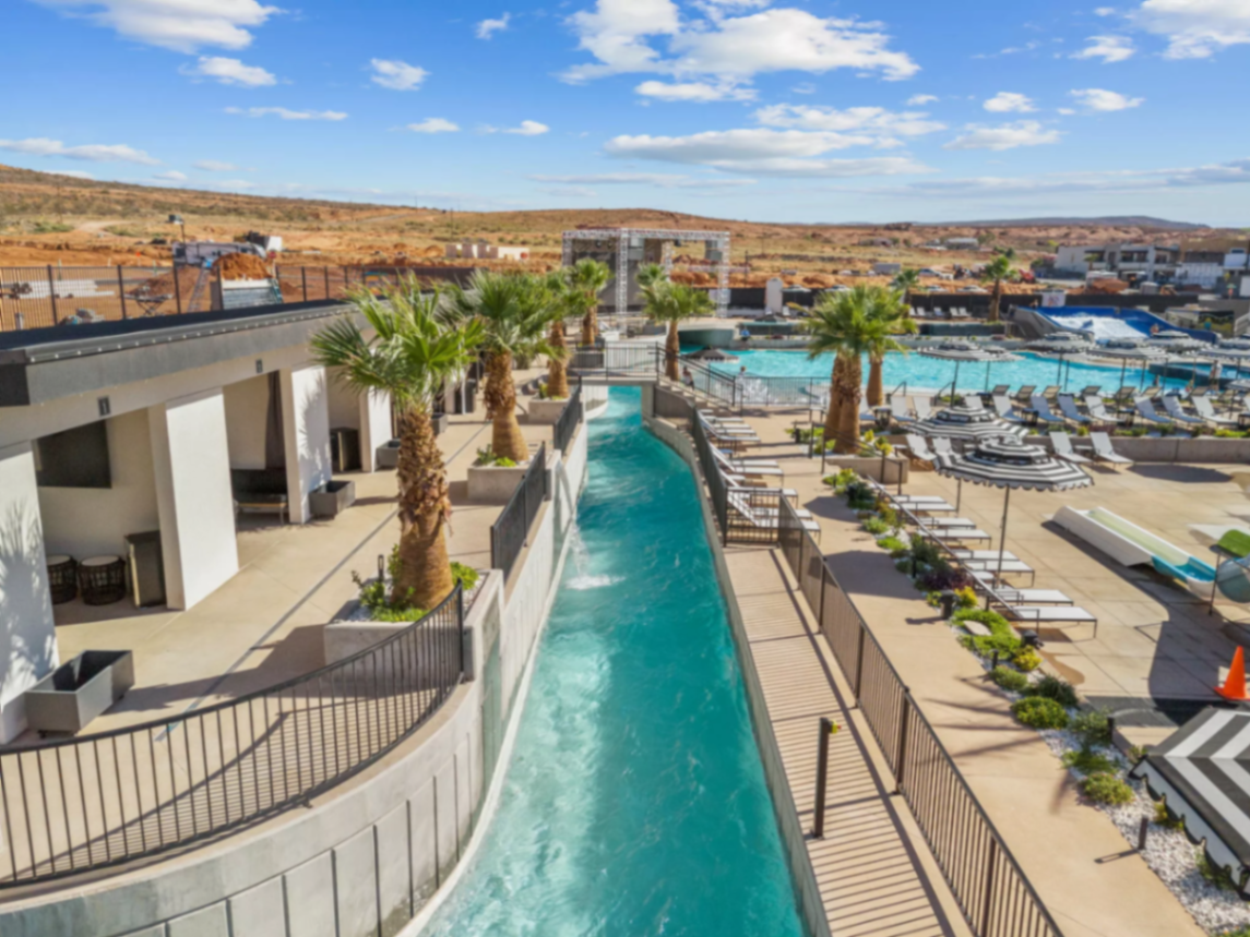 Luxury resort pool with red rock backdrop